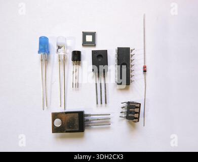 Electronic components on the table. Semiconductor elements: Transistors, integrated circuits, diodes. Stock Photo