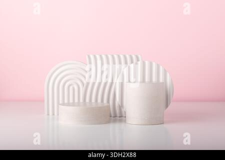 White concrete advertising stands. Gypsum podium for the presentation of cosmetic products. Minimal mock up. Stock Photo
