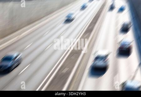 Blurred background of traffic on city street in summer Stock Photo