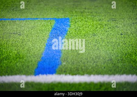 Artificial green turf on a soccer field. Stock Photo