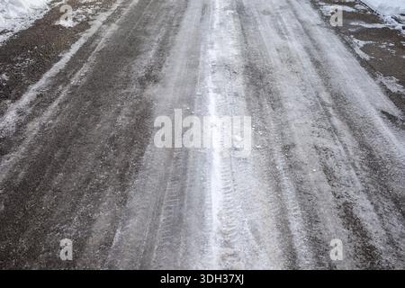 layer of ice on a side street in a residential area Stock Photo