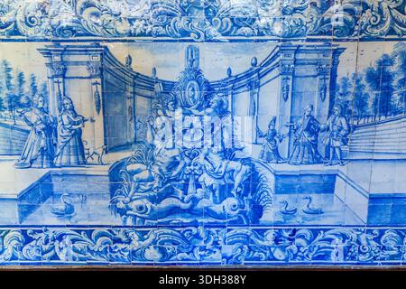 Biscainhos museum. Braga. A detailed blue and white ceramic tile mural depicts a grand, mythological scene with figures in classical attire gathered a Stock Photo