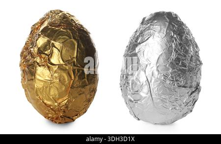 Tasty chocolate eggs wrapped in shiny foil isolated on white Stock Photo