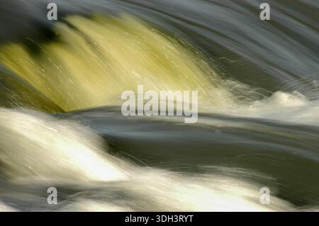 A close-up of the churning rapids of the River Nile in Jinja, Uganda, highlighting the powerful currents, frothy white water, and dynamic flow of Afri Stock Photo