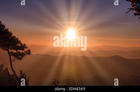 The sunset over mountain range and dramatic sky. Stock Photo