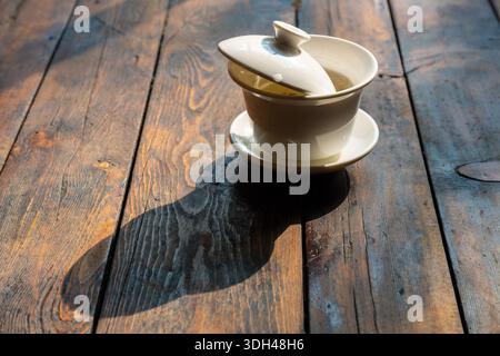 Tea pot sits on wooden table in Chengdu Sichuan during afternoon light Stock Photo