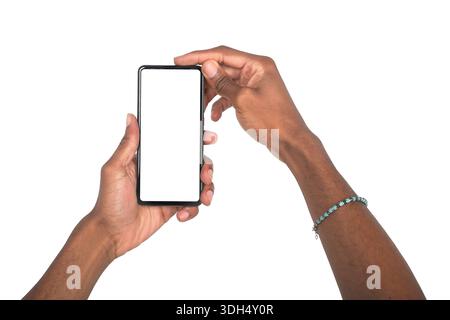 Both hands holding smartphone in front view for app or technology advertising. Black skin male showing digital device with blank screen for promotion Stock Photo