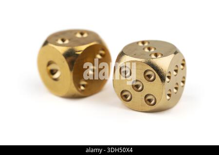 Two golden dice on white background. Stock Photo