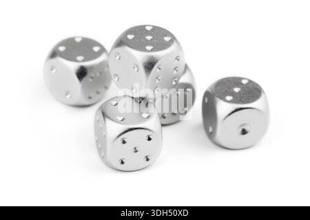 five silver dice view from above on white background. Stock Photo