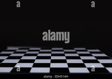 empty chess board on dark background. Stock Photo