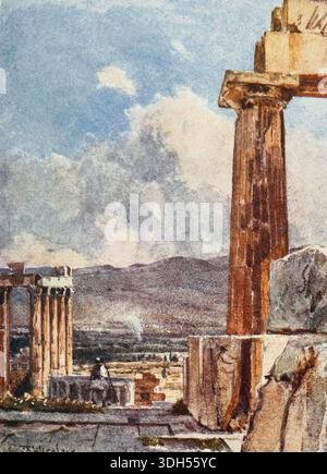 THE EASTERN PORTICO OF THE ERECHTHEUM, VIEWED FROM THE NORTHERN PERISTYLE OF THE PARTHENON The column to the right, with its strong golden-brown local colour, warmed by the full morning summer sun, is the third column counting from the north-cast corner of the Parthenon. The blocks of marble which conceal the lower part of the column form part of the pronaos wall. The east portico of the Erechtheum is seen below to the left, behind are the mountains of Daphni. Painted by John Fulleylove, R.I. Published in 1906 Stock Photo
