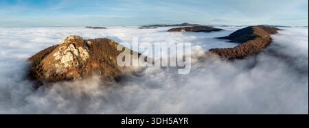 Sunset sun panorama, beautiful fluffy clouds and forest in mountain Stock Photo