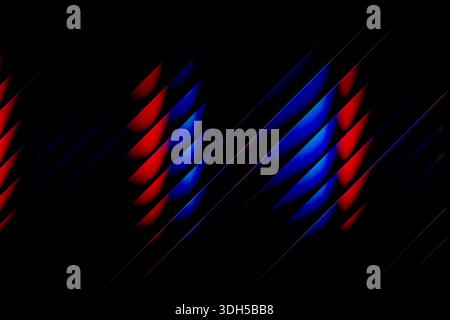 Abstract illustration featuring blue and red neon shapes on a dark background. The dynamic pattern creates a sense of movement, making it ideal for mo Stock Photo