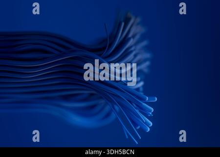 A close up view of blue cables artistically arranged in a swirling pattern. The image captures the intricate details and textures, evoking modernity a Stock Photo