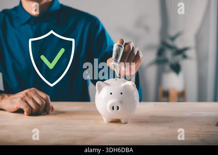 global economic money bank piggy finance concept shows man putting banknote into white piggy bank for growth, secure business invest stock strategy he Stock Photo