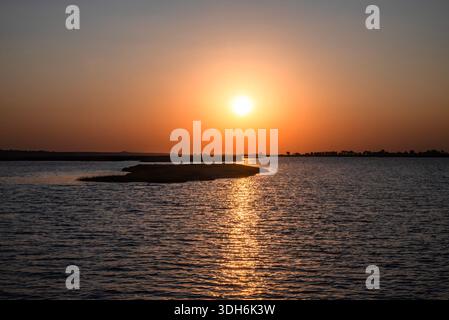 Fiery sunset over the Chobe River, Botswana Stock Photo
