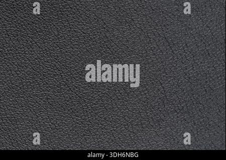 Cow black leather with crease lines texture background close up view Stock Photo