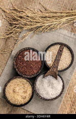 Chinese Rice Strains different kinds of asian rice grains in rustic setting display in ...