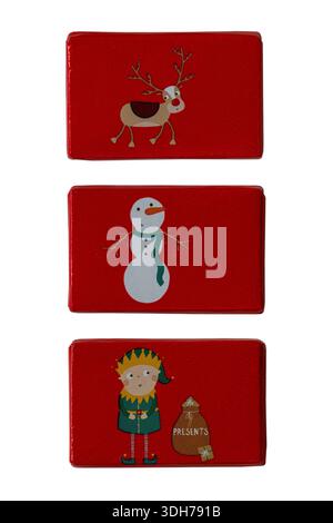 Christmas themed Milk Chocolate Tablets isolated on white background - elf with sack of presents, Rudolph the Red Nosed Reindeer and Snowman Stock Photo