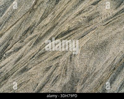 Patterns in the grains of sand on Charleston Beach near Coos Bay in Oregon, USA Stock Photo
