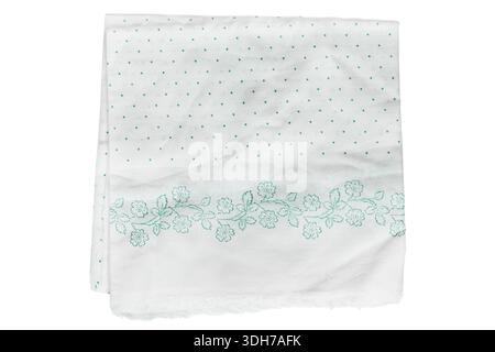 Folded white polkadot cotton tablecloth isolated on white background Stock Photo