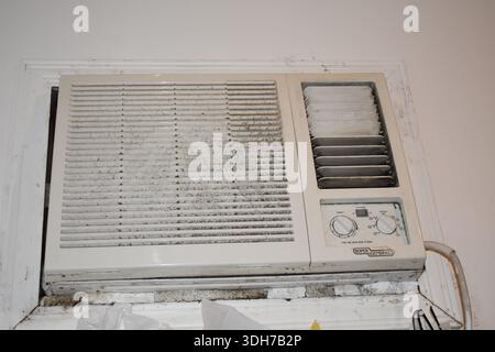 The old Window Air Conditioner on the wall Stock Photo