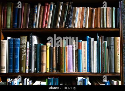 Vintage books on bookshelves Stock Photo