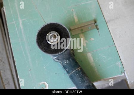electric emery board leaning upwards on a table Stock Photo