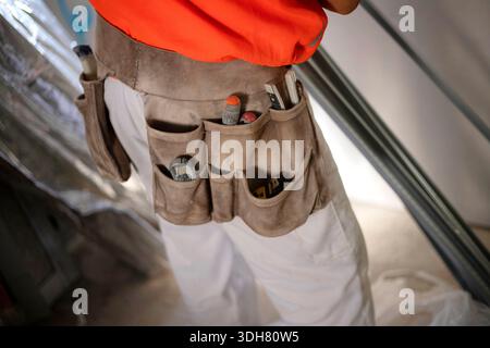 tool belt in use on the worker Stock Photo