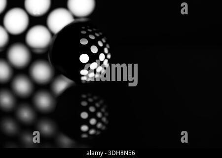 Abstract black polka dot 3d background with crystal ball. Real photography with art effects and negative space. Creative copy-paste background Stock Photo