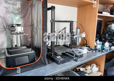 Group of 3d printers to print plastic and resin models in three dimensions. Stock Photo