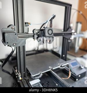 Plastic thread 3d printer with articulated head that prints medium-sized models. Stock Photo