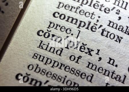 Word complex on dictionary page, macro close-up Stock Photo