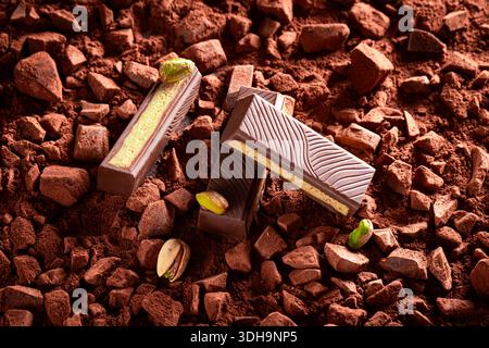 Handmade Dubai chocolate on chocolate bar with cocoa powder. Dubai chocolate on cocoa background. Stock Photo