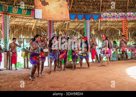 Indigenous Embera men in traditional dress with musical instruments ...