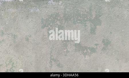 Close-up of a weathered light green concrete wall with a grainy, distressed texture, showing patches of wear and various shades of grey and white. Stock Photo