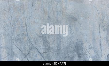 A high-resolution image of a distressed, weathered concrete wall featuring fine cracks, vertical water stains, and a rough, textured surface in shades Stock Photo
