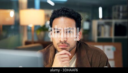Creative, reading and man with computer, office and trend research for ad campaign and working late. Digital marketing, social media manager and Stock Photo