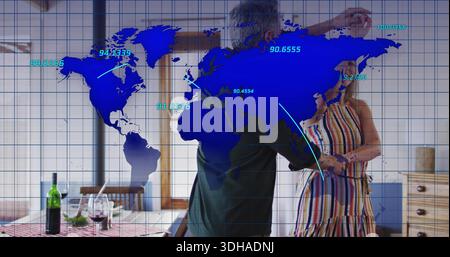 Dancing mature couple embracing in kitchen, striped dress green shirt wine bottle blue map overlay Stock Photo