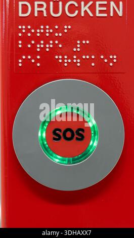 German SOS Button with Writing for PUSH and in Braille for Blind People Stock Photo