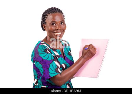 beautiful female teacher in loincloth dress standing on white background giving lessons, smiling. Stock Photo