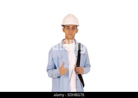 Man in a blue shirt and white hard hat for work Stock Photo
