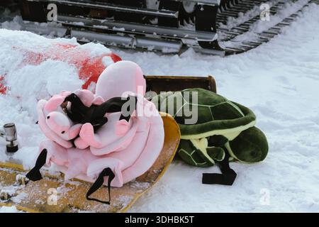 Soft protection for the knees and buttocks while snowboarding or skiing on a ski slope, resort during holidays, weekends. Stock Photo