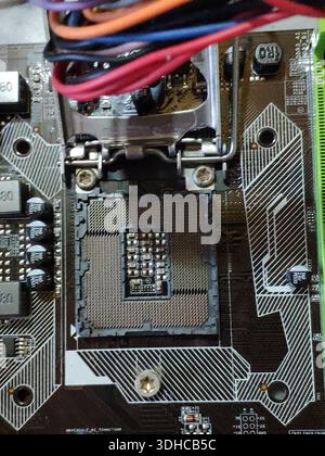 Close-up of CPU Socket on Motherboard with Wires and Components Stock Photo