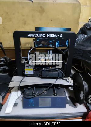 Anycubic Mega-5 3D Printer on Workbench with Filament Spool Stock Photo