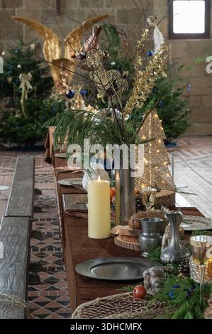 France, Manche, Bay of Mont Saint-Michel listed as World Heritage by UNESCO, Mont Saint Michel, the refectory, table with Christmas decorations Stock Photo