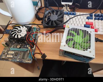 Computer Components and Power Supply on Desk Stock Photo