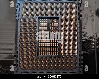 Close-up of a CPU socket with integrated circuit pins on motherboard Stock Photo