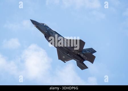 Low angle view of a U.S. Air Force F-35 Lightning II, a fifth-generation stealth strike fighter developed by Lockheed Martin, in climbing flight. Stock Photo