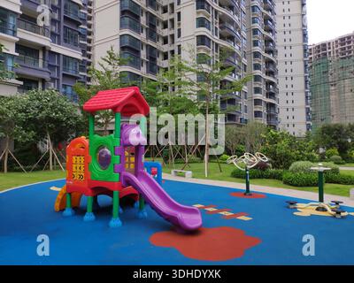 Children's playground with colorful equipment in a modern residential area Stock Photo